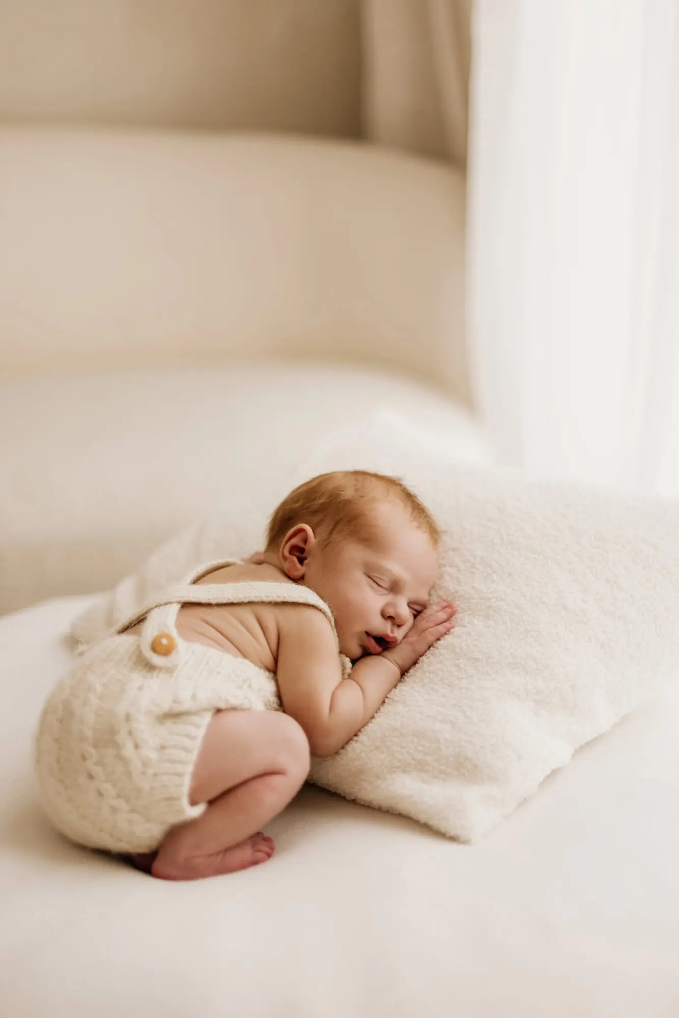 Newborn baby sleeping peacefully in Bradford studio