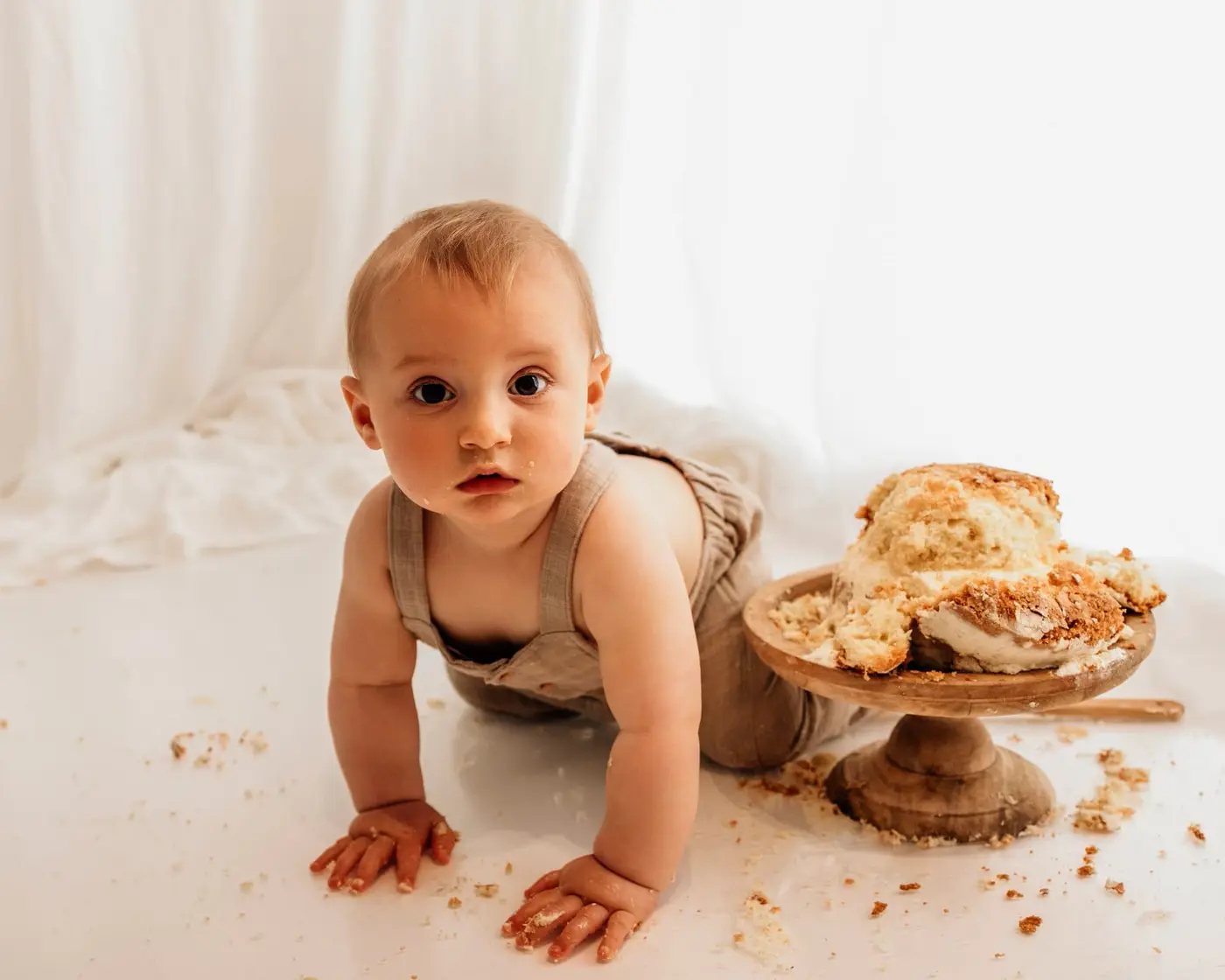baby with cake during a bradford cake smash photoshoot