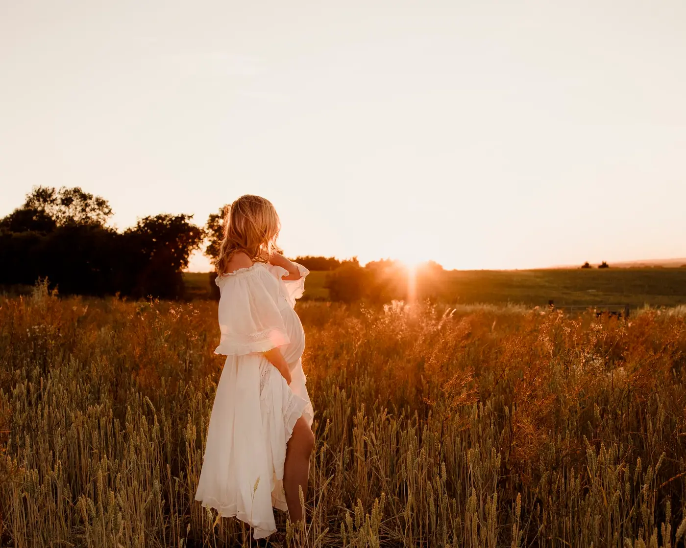 pregnant lady looking at the sunset during a cleckheaton maternity photoshoot