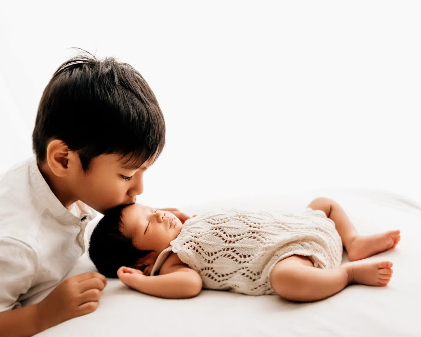 siblings in a leeds newborn photography studio